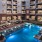 a swimming pool in front of a building