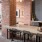 a kitchen with a brick wall